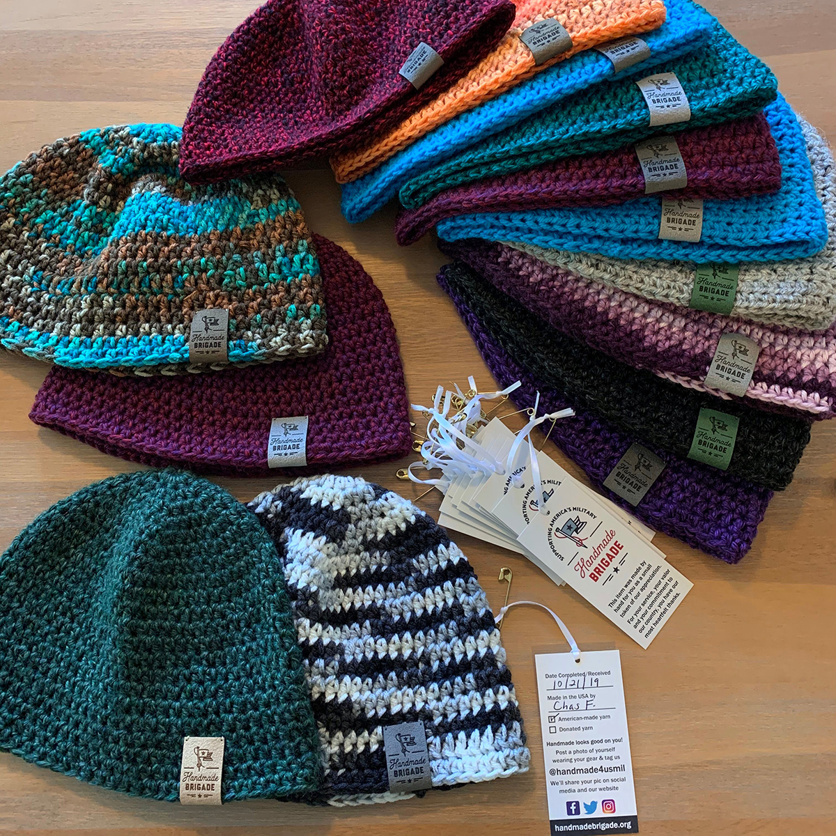 Knitted hats by Handmade Brigade with hang tags